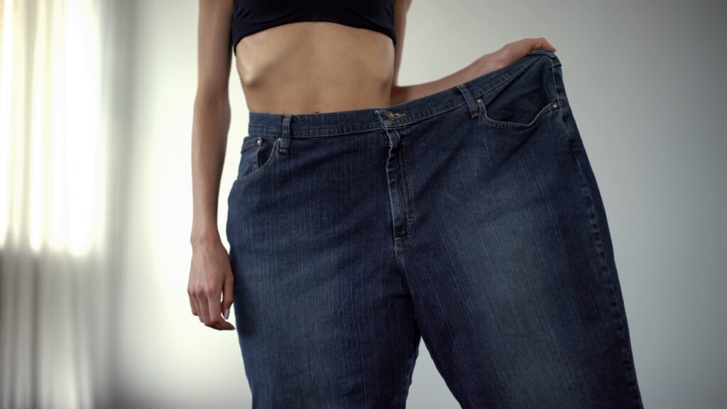 Anorexic girl wearing one trouser-leg, fat people vs skinny, rapid weight loss