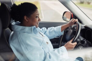 young woman driving after gastric sleeve surgery