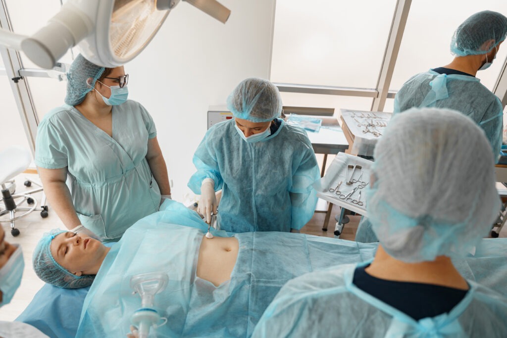 Concentrated surgical team working with a patient in an operation room. High quality photo